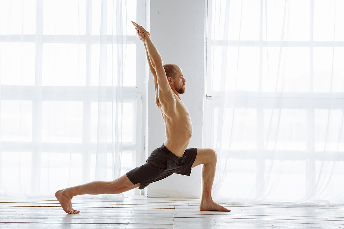 bare chested man doing yoga